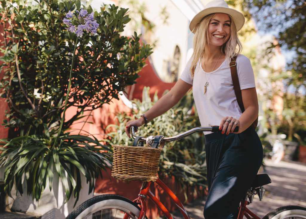 Stylish happy blond Copenhagen Smykke woman on bike.jpg